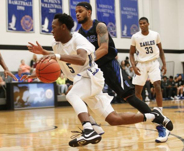 Kirkwood's Devonte Thedford (5) drives around DMACC's DeShawn Davidson (1) during the first quarter at a Kirkwood Community College men's basketball game at Johnson Hall on the Kirkwood campus in Cedar Rapids on Wednesday, Jan. 9, 2019. (Rebecca F. Miller/The Gazette)